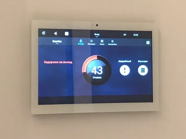 One touch panel showing the security system status